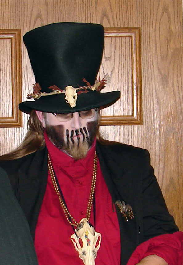 man with skull on head and face wearing top hat