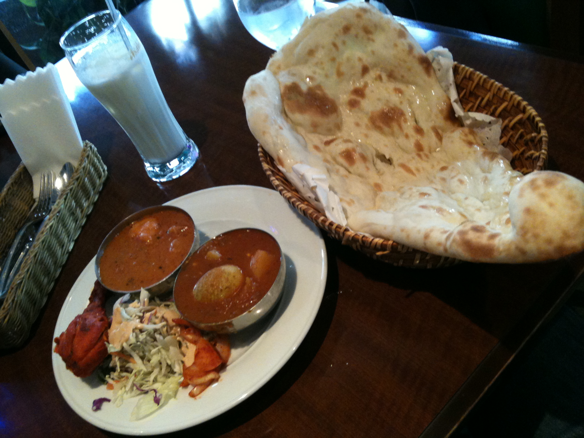 food items, including naan bread, is served on a table