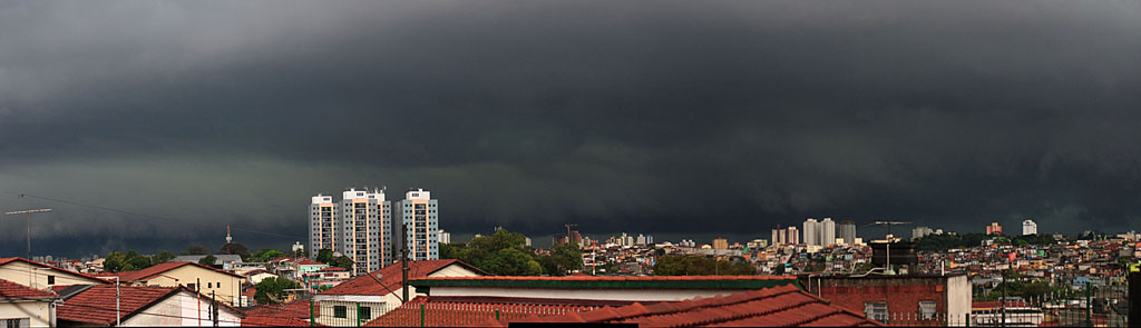 dark storm clouds loom over the city
