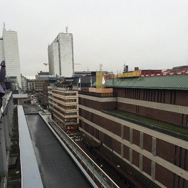 an overhead view of a city with tall buildings