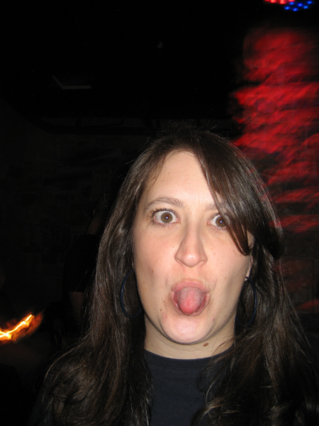 a woman making a funny face at an event