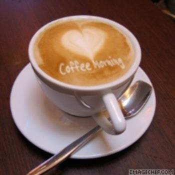 a cup of coffee with the word coffee herring in a painted heart