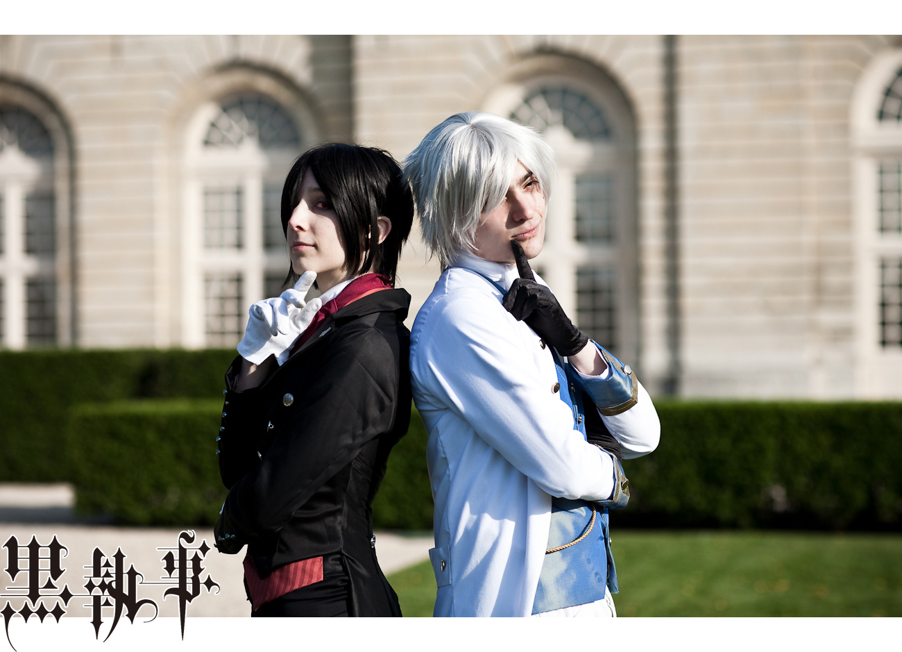 two people dressed in cosplay clothes in front of a castle