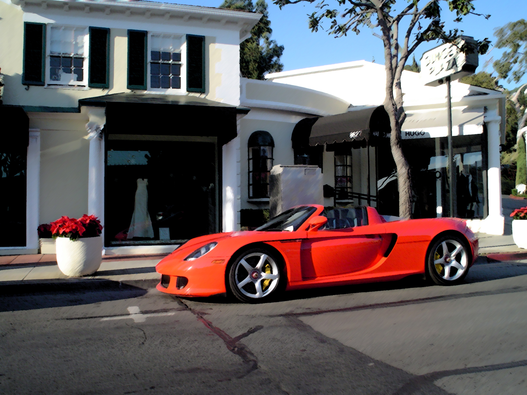 an orange convertible parked on the side of a street