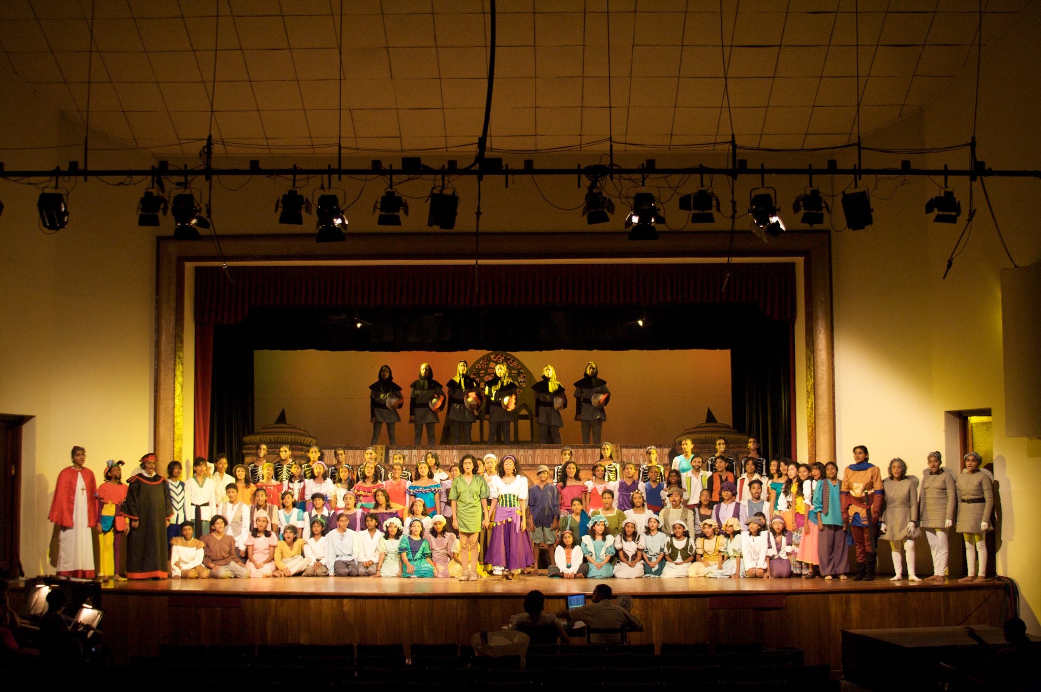 a crowd of people standing on top of a stage