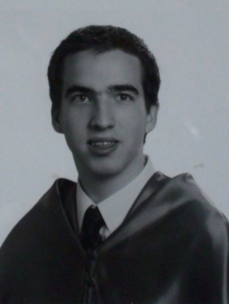 a portrait picture of a young man dressed like a graduate