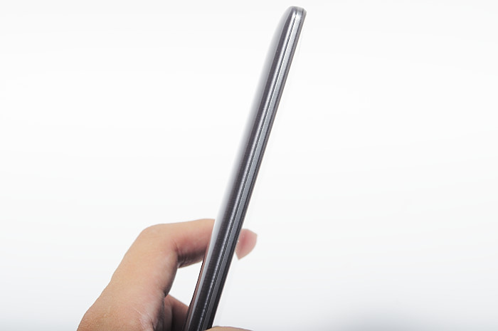 a hand holding a pen that is in the palm of a phone