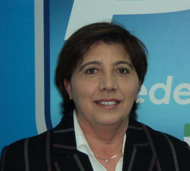 a woman with short hair wearing a black suit jacket