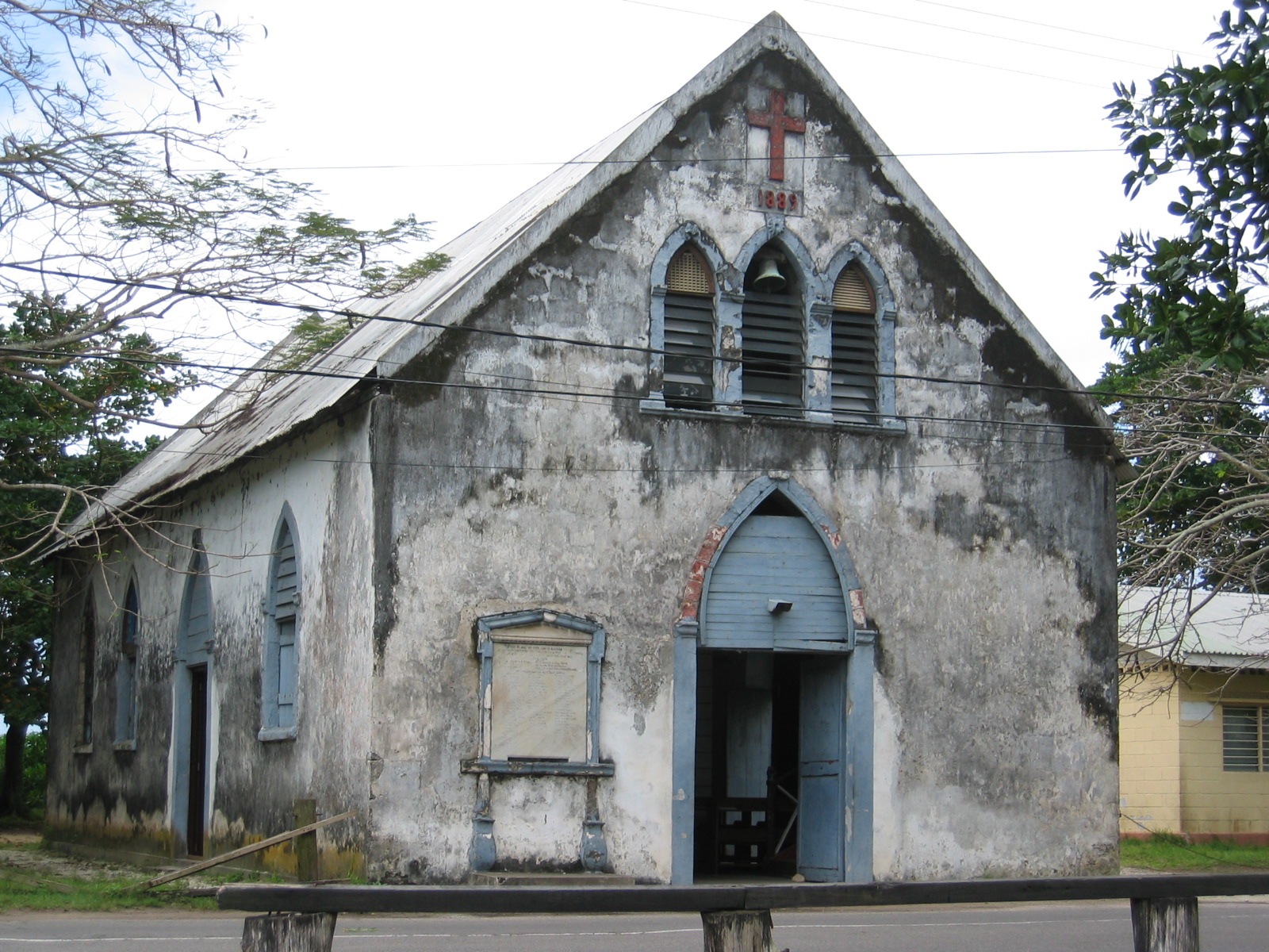 a run down church with a clock on it