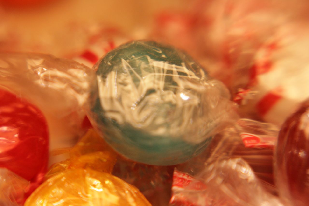 a pile of colorful candy wrapped in cellophane