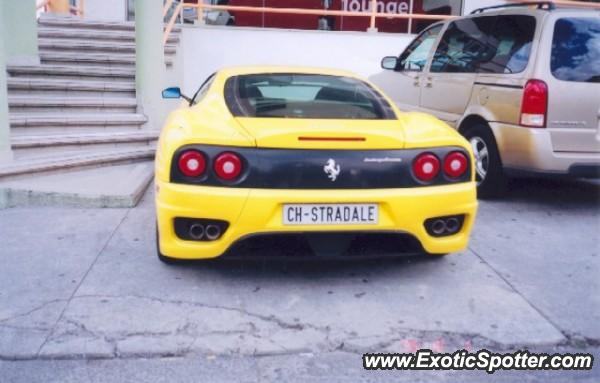 the back of a yellow and black sports car