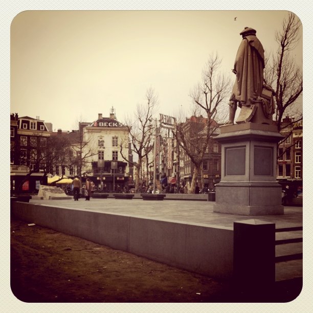 a monument is in a large open city park