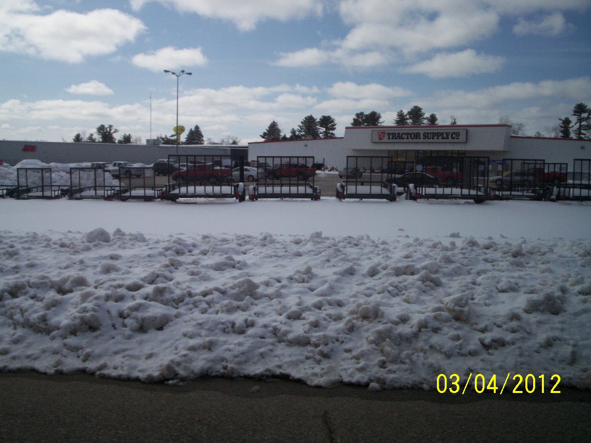 a large area of snow outside of a store