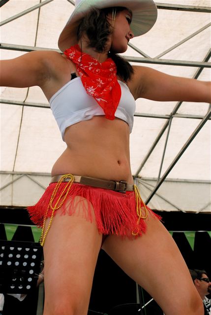 an image of a person wearing a hat performing on stage