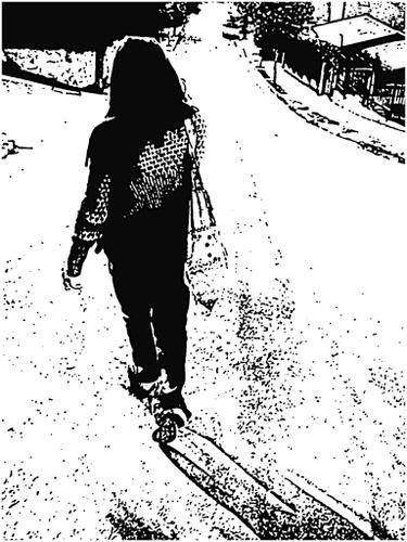 a skateboarder wearing a hat and a scarf walks down the street with his board