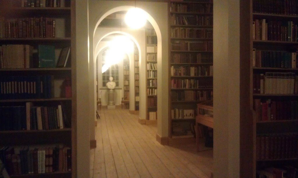 the large room is full of books and lights