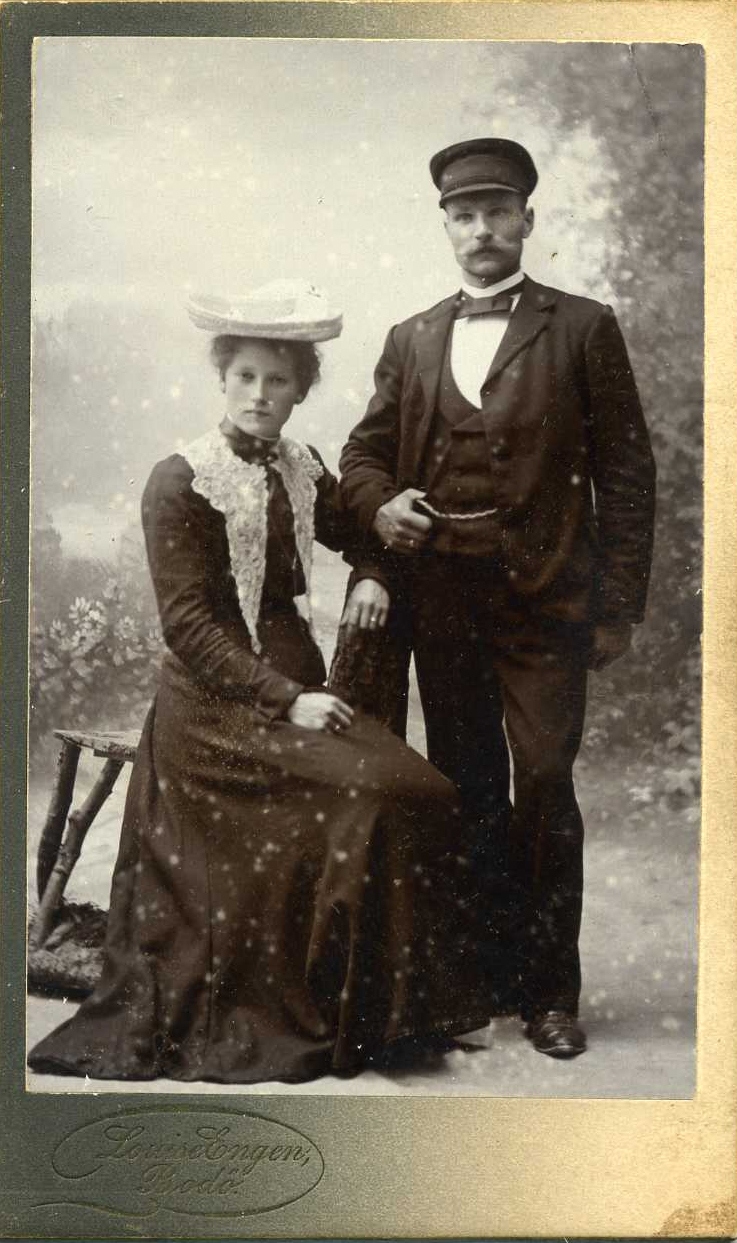 an old po of a man and woman wearing hats