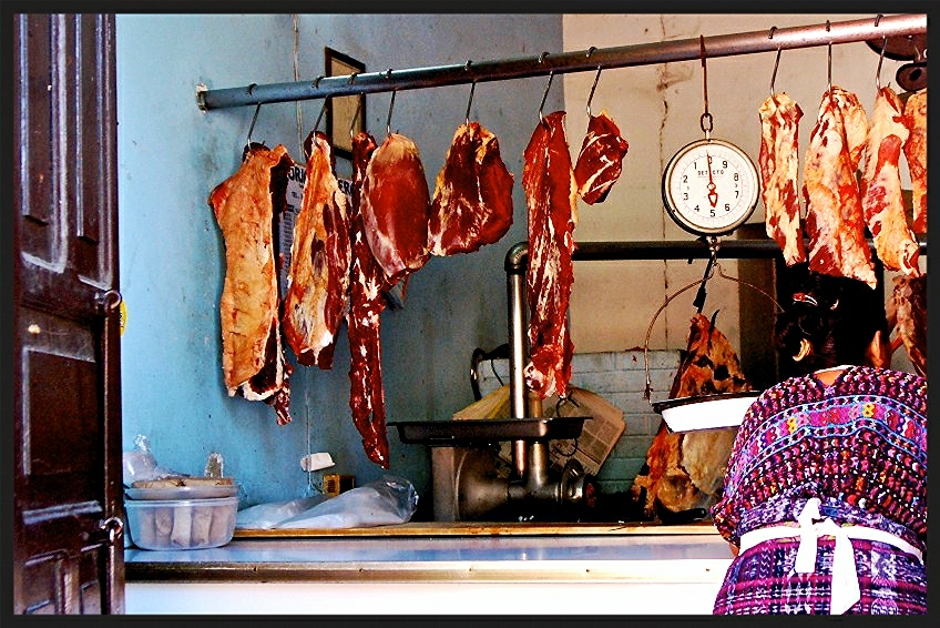 a counter top filled with lots of meat