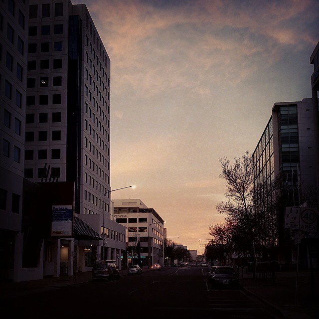 a few buildings on the side of the road near one another