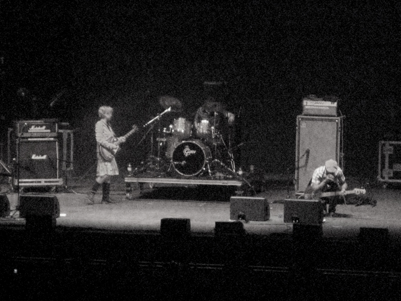 a black and white po of a band performing on stage