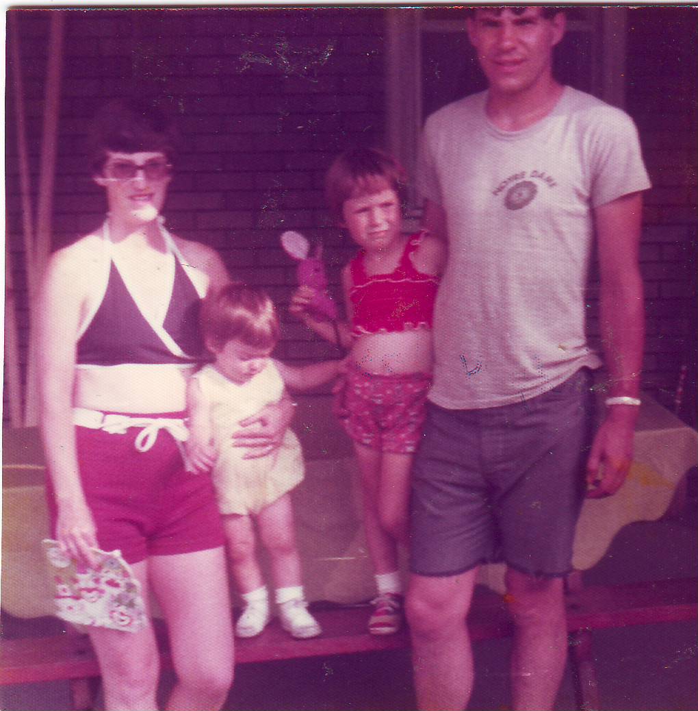 a man is posing with two children