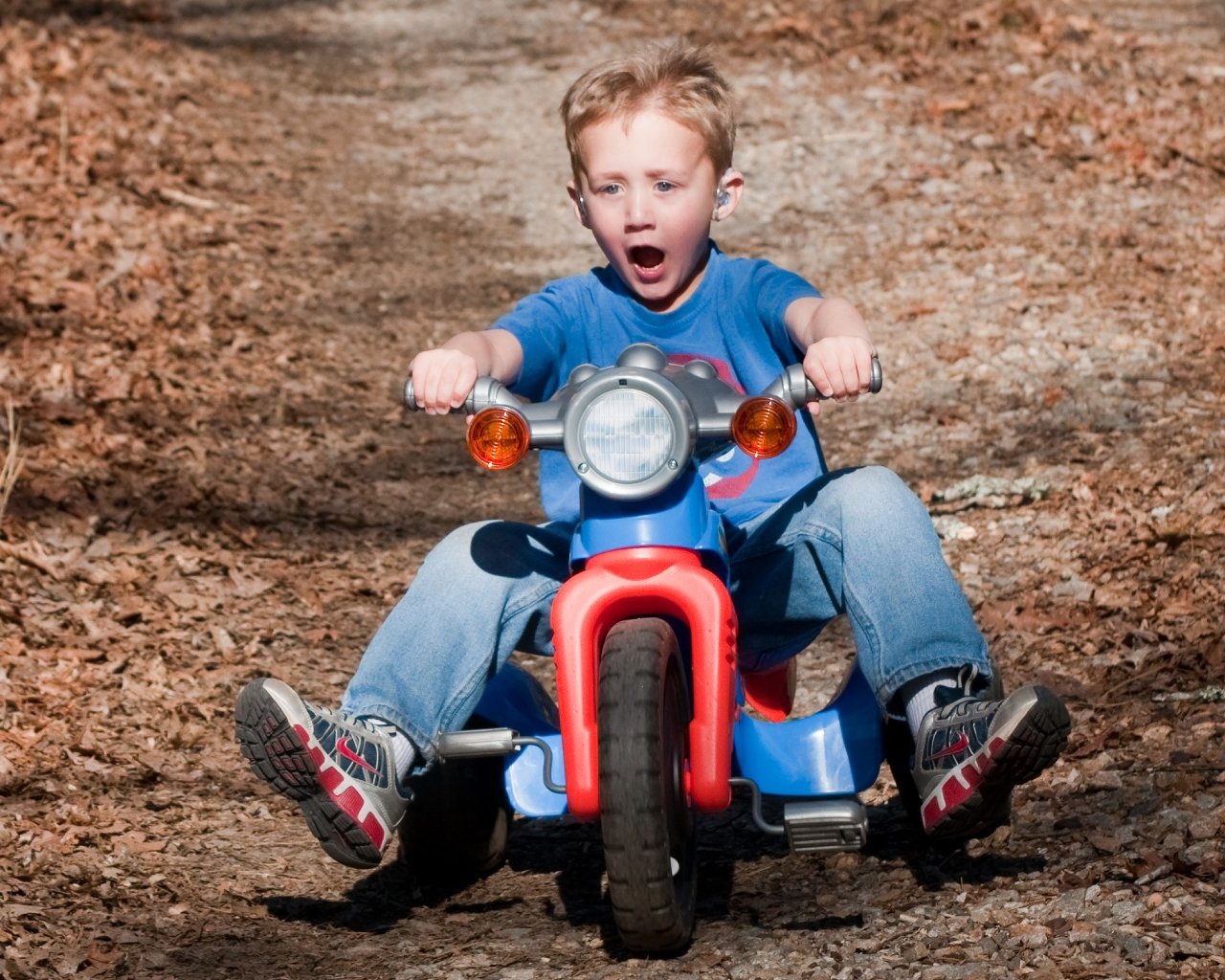  rides his motorcycle outside during the day