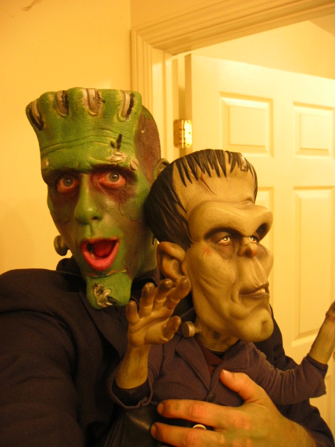 two scary men with green faces and hair