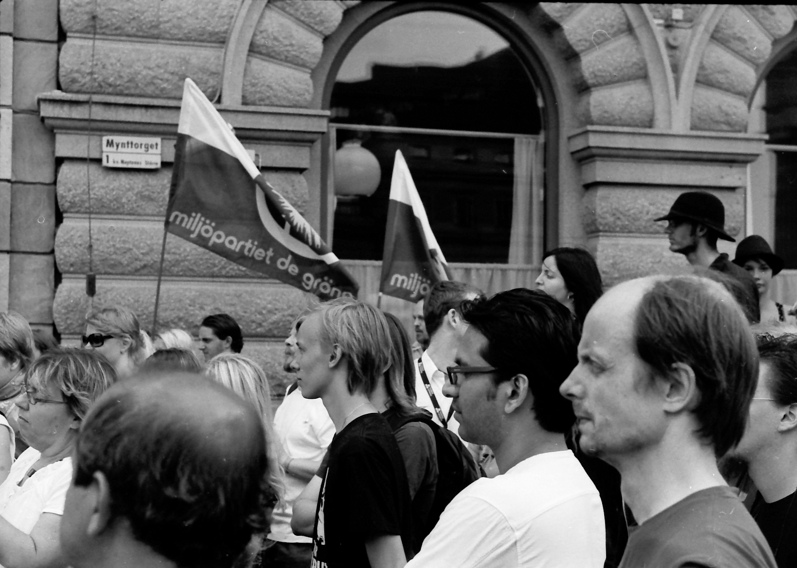 many people are standing in a group outside