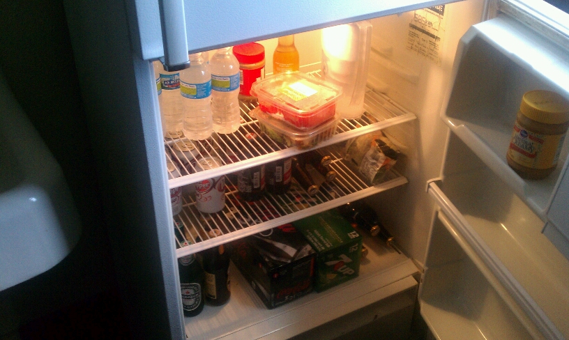 a refrigerator filled with lots of food and drinks