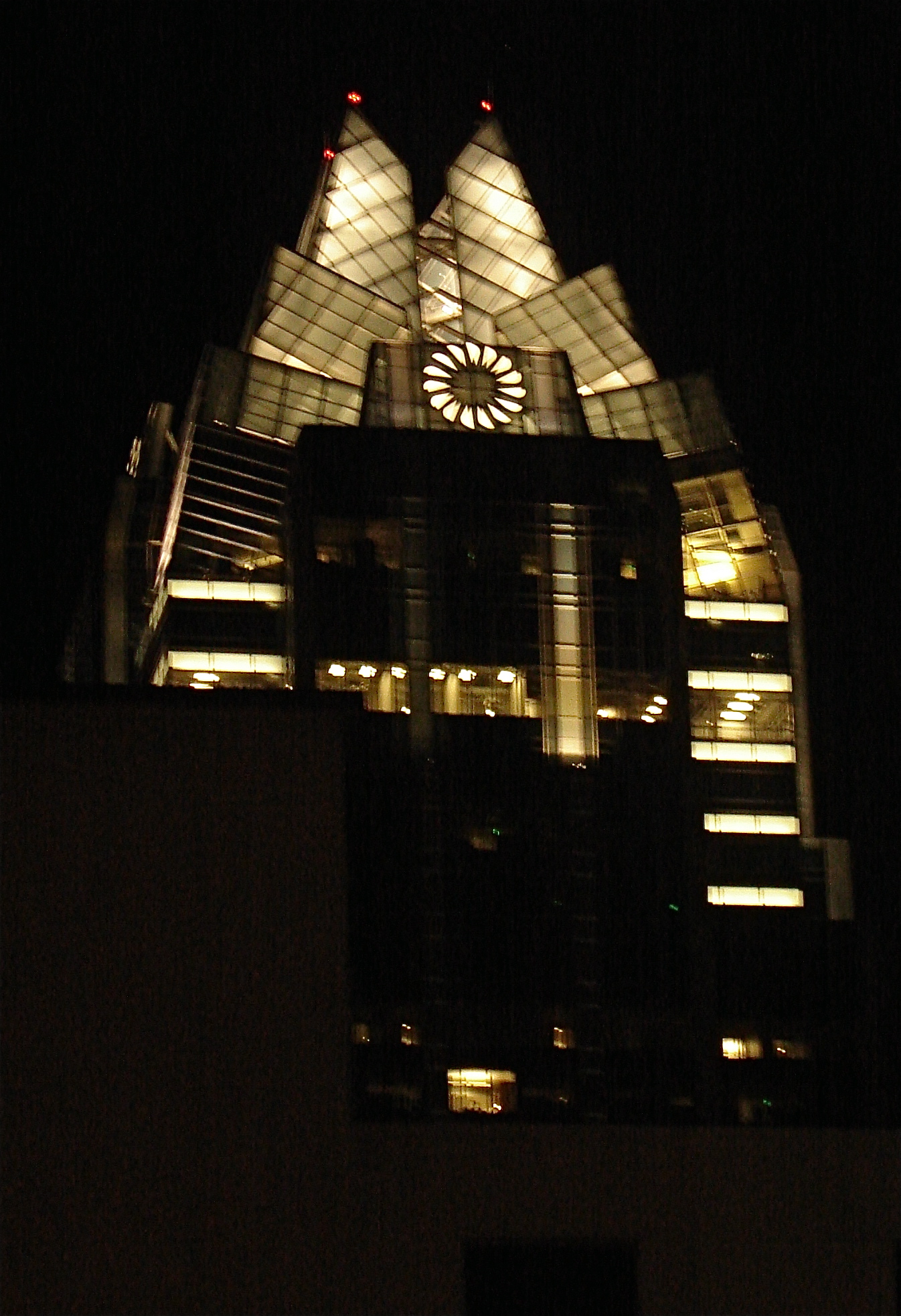 a building at night with a clock at the top