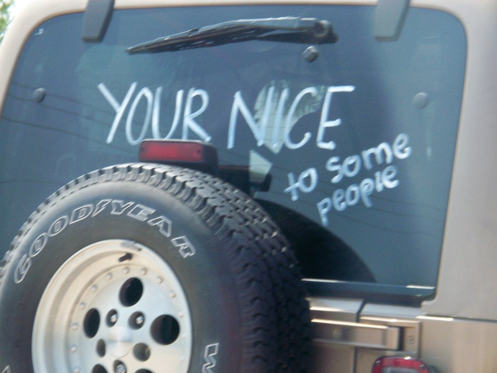 the side of a truck is painted with graffiti