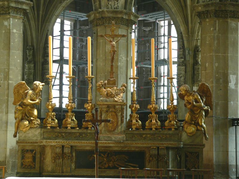 an ornate church with golden gargoyles on display