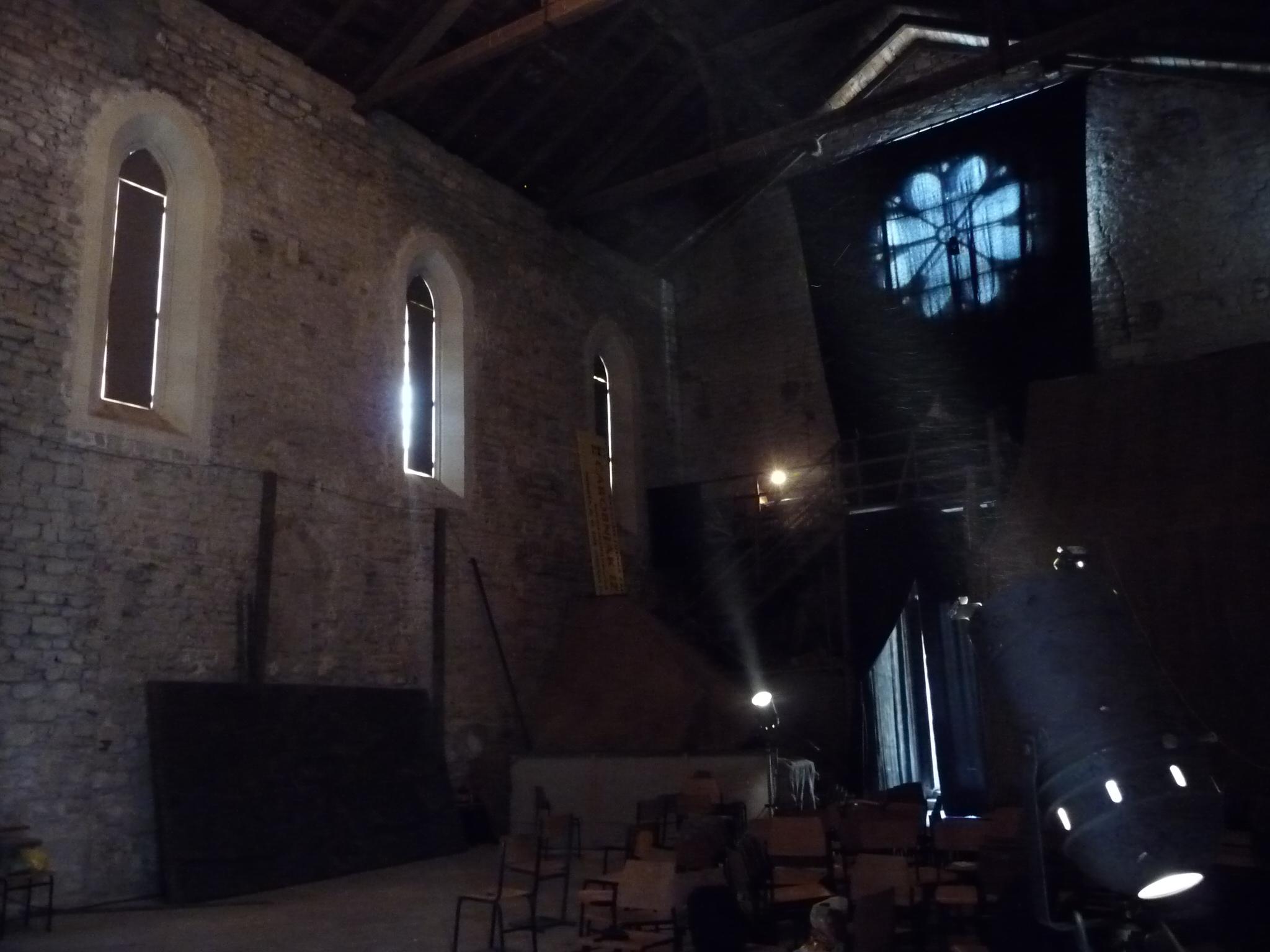 an old building with a large clock on the wall