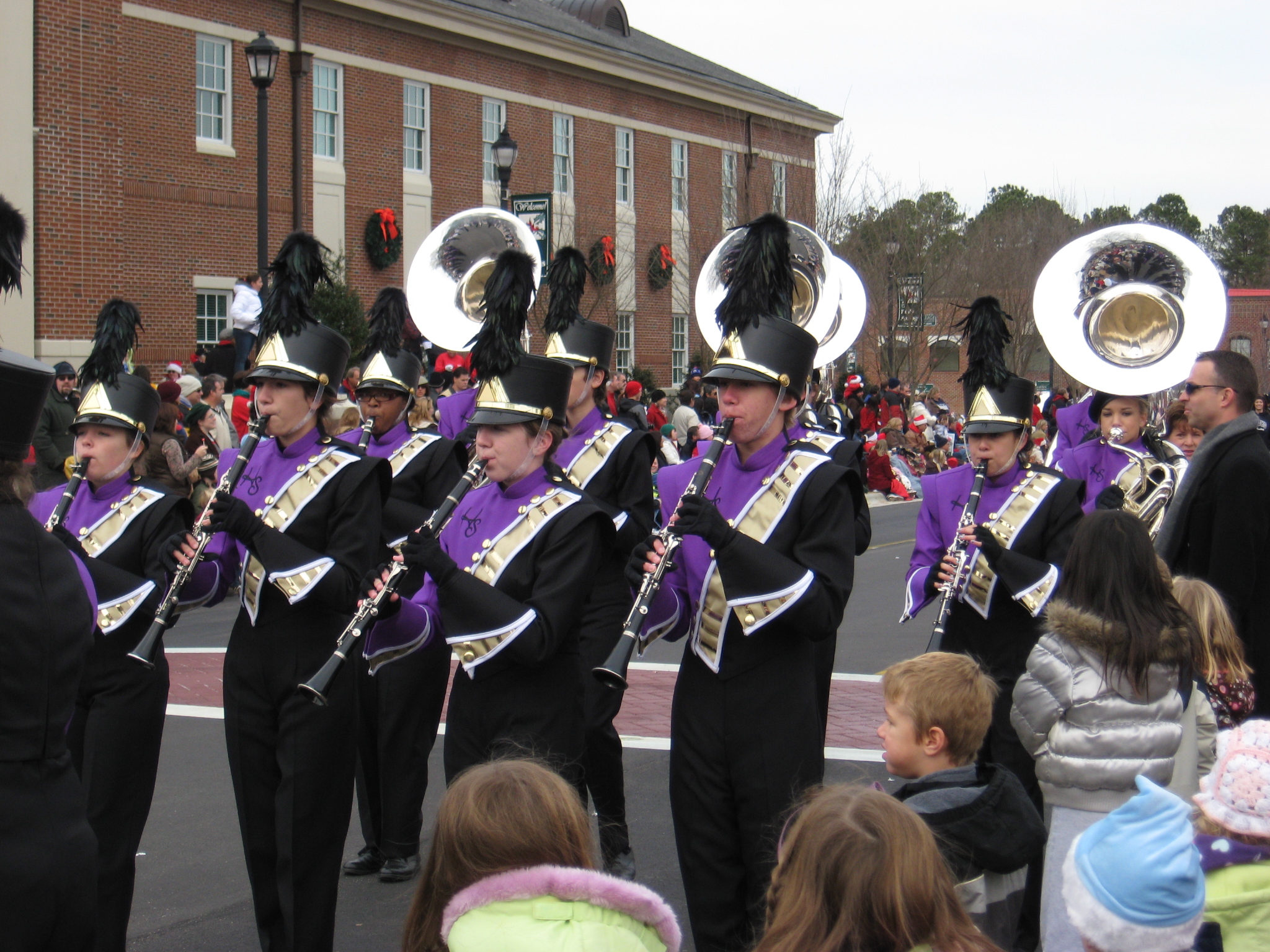 a large marching band on a city street