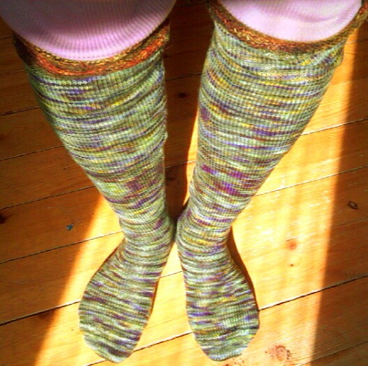 the legs and legs of a woman in colorful socks