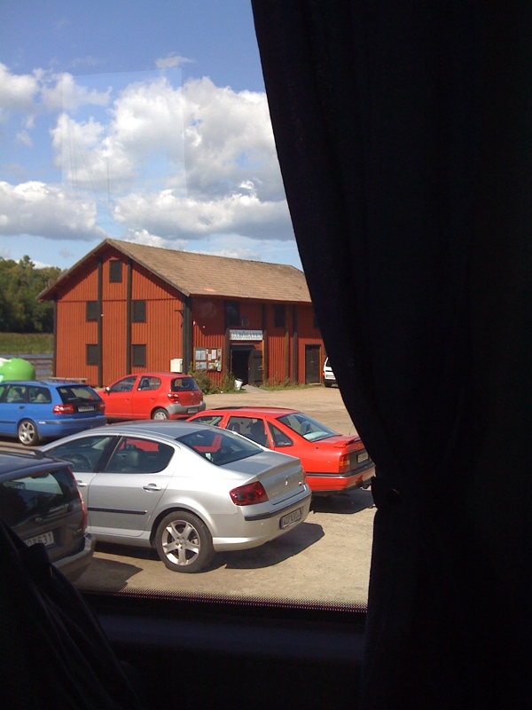 several cars in the parking lot of a building