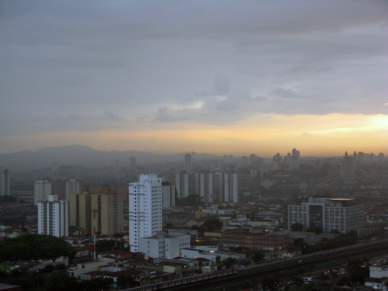 sunset at an industrial cityscape with high rise buildings