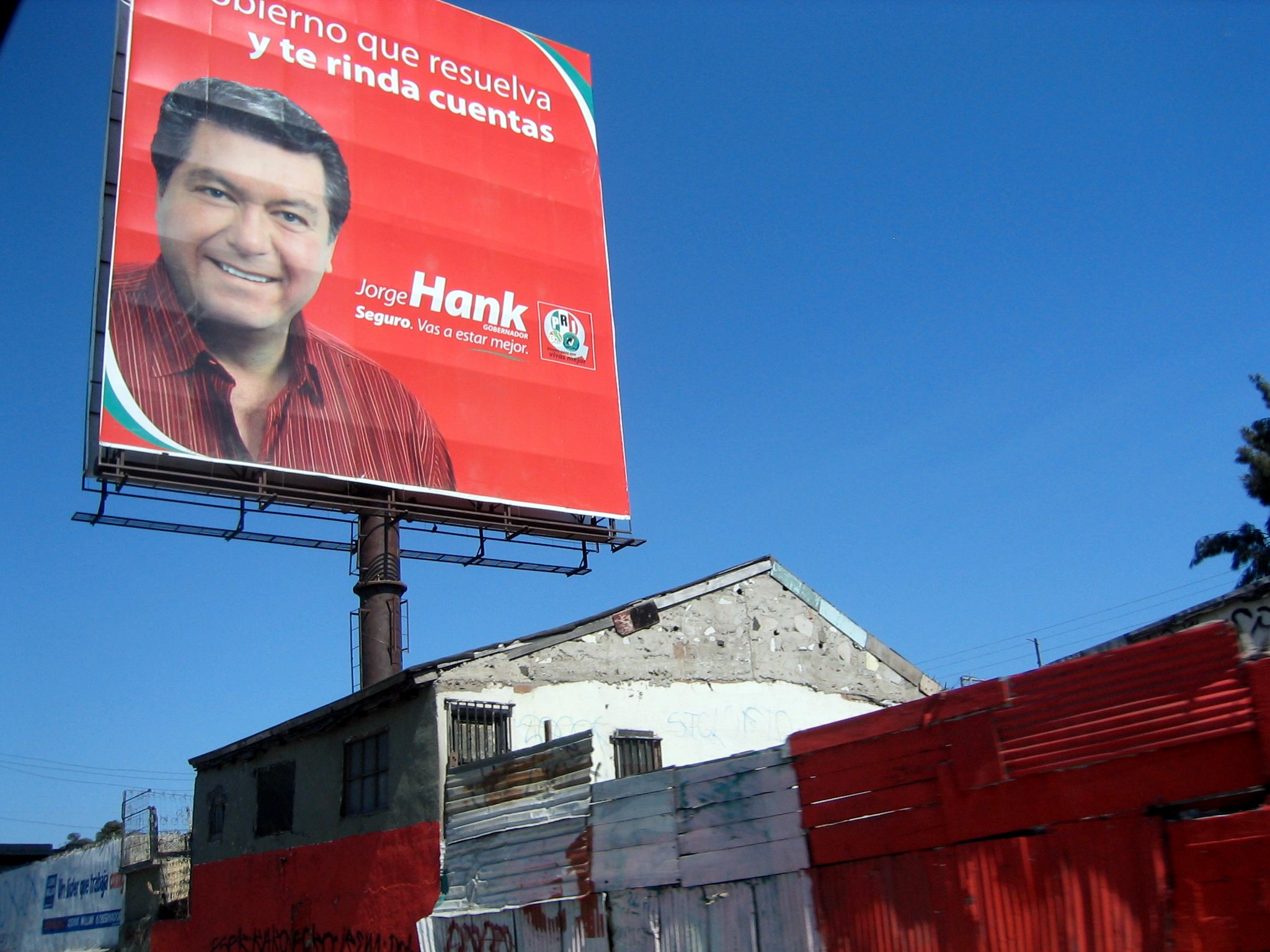 billboard on a street corner advertising the company