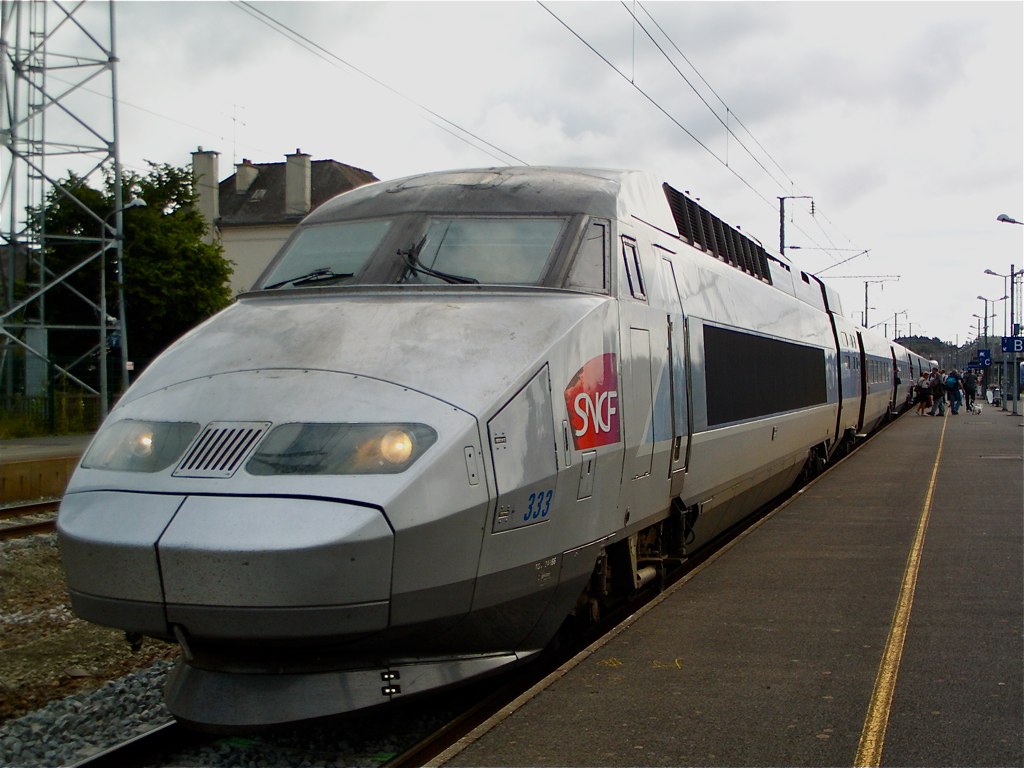 a modern high - speed passenger train at the station