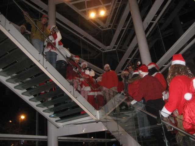 christmas decorations decorate the glass balconies in this po