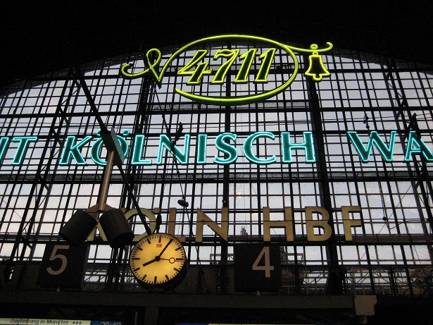 a lighted clock is below the words of the station