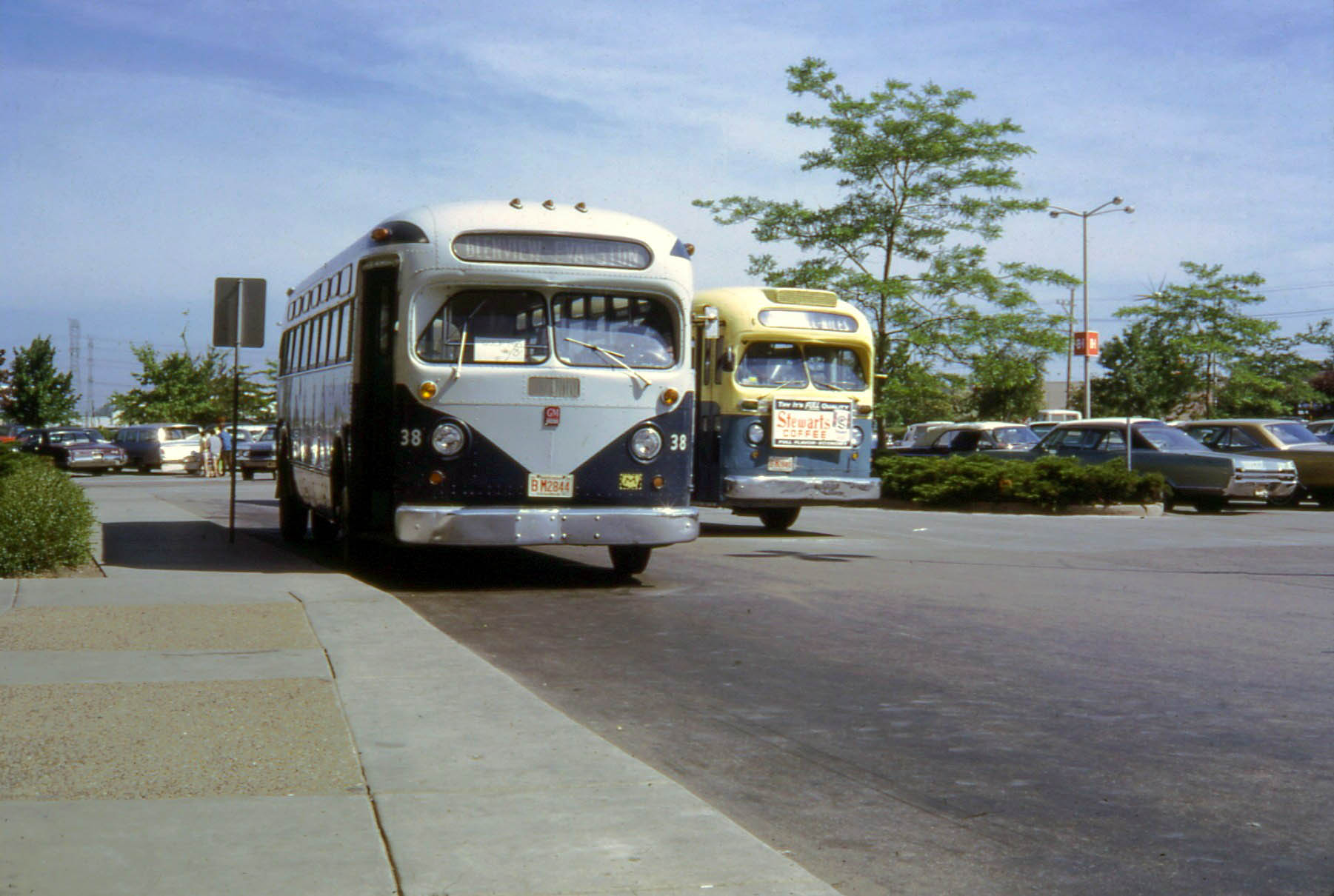 two buses that are sitting in the street