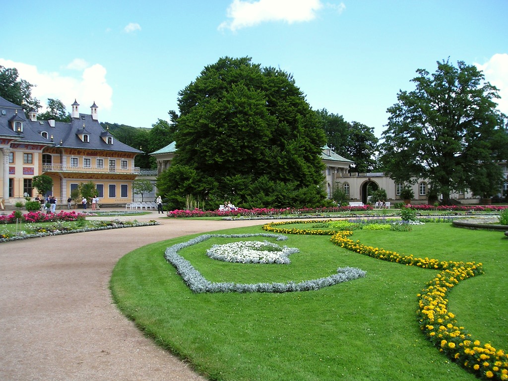 a very pretty flower garden on the ground