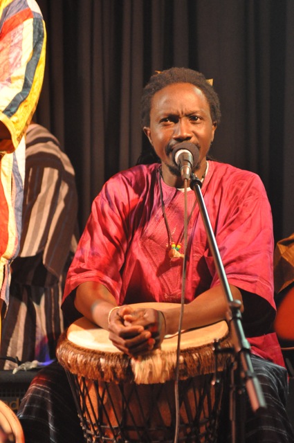 an image of african man playing musical instrument