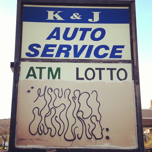 a close up of a sign advertising auto service