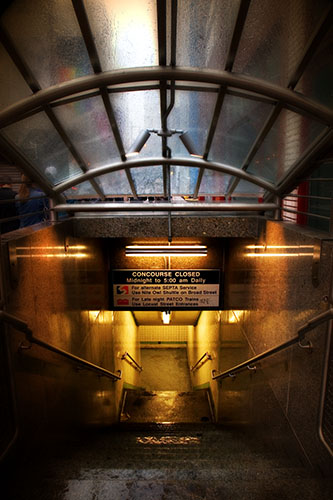 a dark and dirty subway station is shown