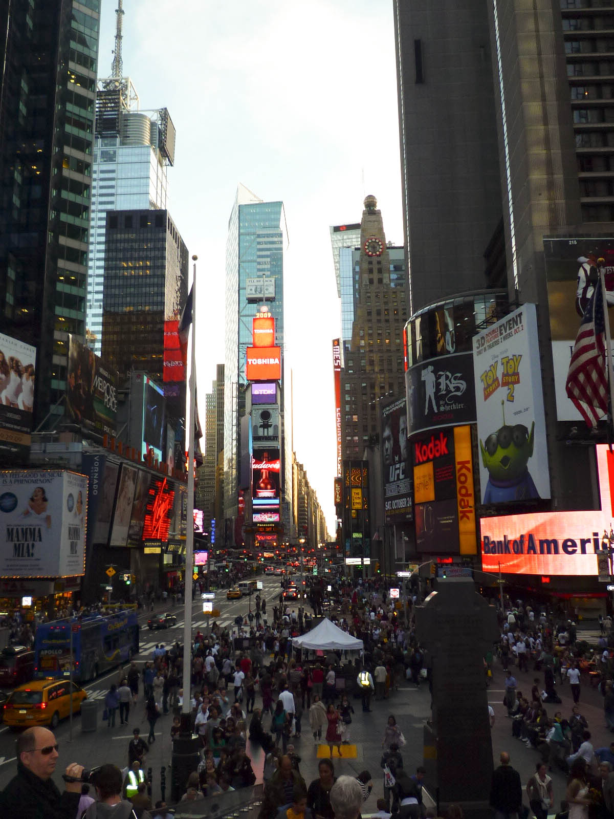 busy street with many people on it in the city