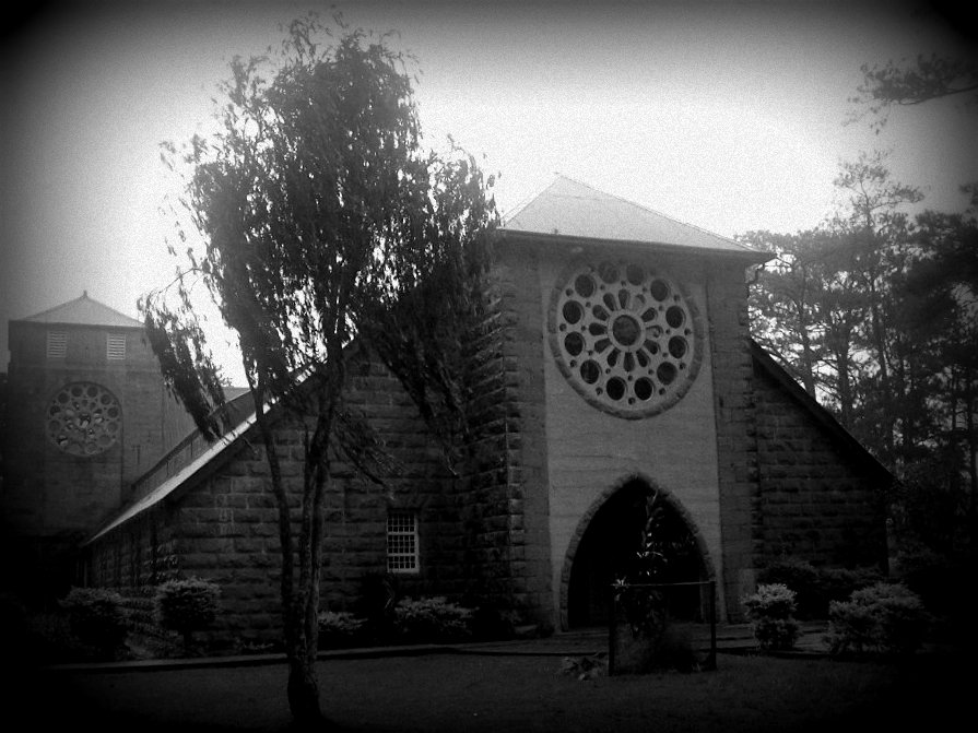 black and white po of a church on a misty day
