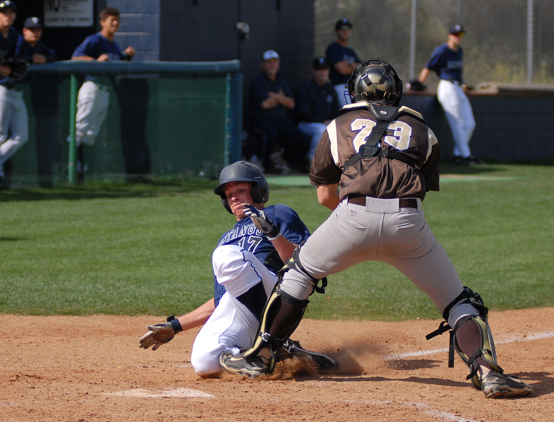 a player sliding into home base during a game