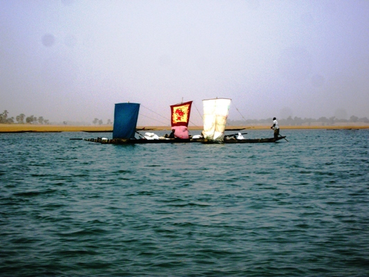a boat sailing across a large body of water